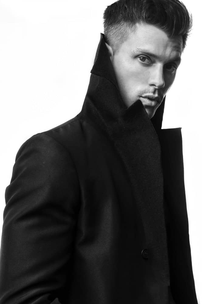 Kenny Braasch modeling a peacoat in black and white.